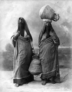 two women with baskets on their heads