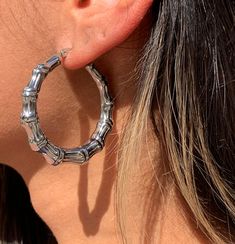 Silver Bamboo Hoop Earrings Hoop size: 6mm x 45mm Height: 45.000mm Length: 45.000mm Weight: 0.560oz Clasp: Hinged  Thank you for visiting and supporting our small business! We hope you will find a stylish piece that speaks to you! ♥ All of our piece our carefully curated and handmade by our all-female team in Miami, Fl ♥ Our materials are ethically sourced for durability About us: ♥ MaLi Beads was started 10 years ago by two sisters while in high School. What started as a hobby became a business Silver Bamboo Earrings, Chunky Silver Hoop Earrings, Hoop Earrings Large, Bamboo Hoop Earrings, Bamboo Earrings, Beaded Boxes, Hammered Gold, Earrings Hoop, Two Sisters