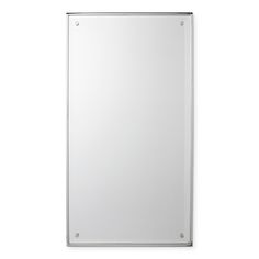 a white wall mounted mirror on the side of a wall