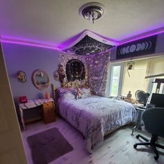 a bed room with a neatly made bed and purple lighting