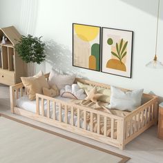 a living room filled with lots of furniture and pictures on the wall above it's bed