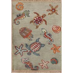 an old rug with many different designs on the front and back side, including sea animals