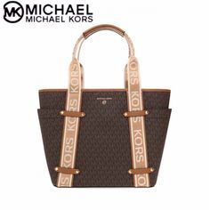 Michael Kors' Maeve Tote Is A Tribute To The Label's Signature Style. Featuring Logo Tape Straps And High-Shine Pyramid Studs, It’s Designed With A Spacious Interior And Side Pockets To Keep All Your Daily Essentials Conveniently And Safely Within Reach. -Gold Hardware -Snap Closure -Interior: 1 Back Zip Pocket, 1 Front Slip Pockets -Exterior: 2 Side Slip Pockets -Tech Compatibility -Approx. 12.5" W X 8.25" H X 4.75" D; 7" Handle Drop; 20" - 23.75" Adjustable Strap Length -Fabric Lining -Detacha Michael Kors Bedford, Michael Kors Tote Bags, In Logo, Color Cafe, White Tote, Monogram Prints, Black Leather Bags, Chanel Deauville Tote Bag, Purses Michael Kors