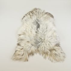 an animal fur rug on a white background