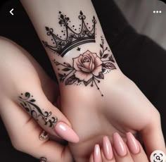 two hands with tattoos on them, one has a rose and the other has a crown