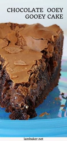 a piece of chocolate ooey gooey cake on a blue plate with text overlay