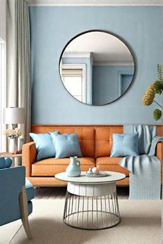 a living room filled with furniture and a round mirror on the wall above it's coffee table