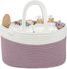 a white and purple basket filled with personal care items on top of a white surface