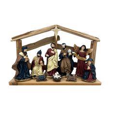 a nativity scene with figurines of people and a baby jesus in the manger