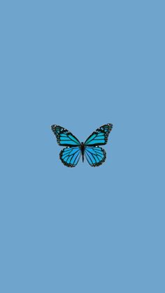 a blue butterfly flying in the sky