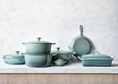 a group of pots and pans sitting on top of a counter