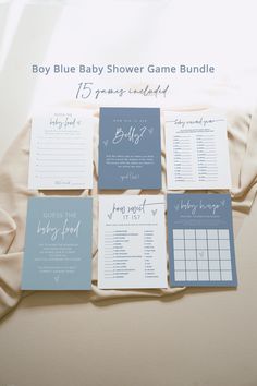 the baby shower game bundle is laid out on a bed