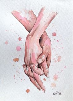 two hands holding each other with pink paint splatters