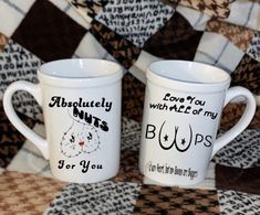 two coffee mugs with words written on them