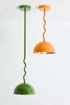 two green and orange lamps hanging from the ceiling