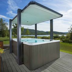 a hot tub sitting on top of a wooden deck