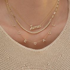 The Diamond Script Name Necklace is the perfect start to any necklace layer. You can choose from 1-10 diamond script letters to create a custom, one-of-a-kind piece that is sure to become your everyday staple. Name Necklace Gold Layered, Pearl Name Necklace, Vertical Name Necklace, Name Necklace Stack, Necklace Name Design, Diamond Name Necklace, Neck Necklace, Necklace With Kids Names, Script Letters