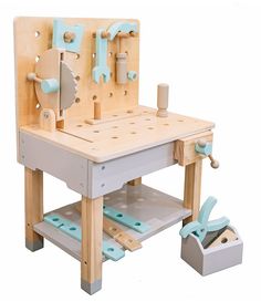 a wooden work bench with tools on it