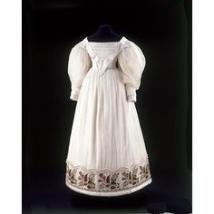 Dress, 1830. This dress may well have been a wedding dress as it is so rich in detail and trimmings. White weddings were becoming widespread as a result of the fashion for muslin dresses. Before the 1800s most people wore coloured dresses to their marriage ceremony, which they continued to wear for special occasions long after the event. Muslin Dress, Museum Fashion, Historic Clothing, Instagram Dress