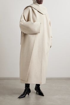 The Row's 'Notte' coat is designed with draped panels along the neck that create the illusion of a coordinating scarf. Made from plush cashmere, it has a loose, longline shape and comes in a versatile beige hue. Draped Coat, Winter Scarf Fashion, Fringe Coats, Camel Style, Scarf Jacket, Coat Trends, Longline Coat, Cashmere Coat, Cashmere Wool