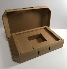 an open cardboard box sitting on top of a table