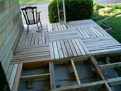 a wooden deck is being built in front of a house