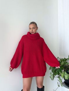 Details: Turtleneck sweater dress Chunky knit Oversized Ribbed Wide sleeves Size + Fit: Model is 5'4 Wearing size small Fabric + Care: 100% polyester Red Sweater Dress Outfit, Red Turtleneck Outfit, Dress With Thigh High Boots, Dresses With Thigh High Boots, Flame Sweater, Turtleneck Outfit, Red Sweater Dress, Sweater Dress Outfit, Red Turtleneck