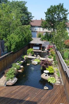 a small pond in the middle of a wooden deck