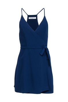 Get ready to make a statement in this Amanda Uprichard navy sleeveless wrap mini dress! Perfect for a date night or night of dancing, this dress exudes charm and style. Pair it with a strappy open-toe heel and silver jewelry for a complete head-turning look. Size S 100% Polyester Unlined Wrap tie closure Sleeveless Bust 30" Waist 23" Shoulder to hem 34.5" Sleeveless Fitted Wrap Dress For Night Out, Elegant Mini Dress With Wrap-around Straps, Elegant Mini Dress With Wrap-around Straps For Date Night, Chic Wrap-around Strap Dress For Night Out, Elegant Sleeveless Mini Dress With Wrap-around Straps, Chic Sleeveless Wrap Dress For Night Out, Chic Dress With Wrap-around Straps For Night Out, Elegant Dresses With Wrap-around Straps For Night Out, Chic Navy V-neck Mini Dress