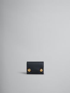 Trunkaroo trifold wallet crafted from calfskin leather. Embossed Marni lettering and oversized stud details. Snap button closure. Zip coin pocket, note compartment, and six card slots. Japanese Wallet, Wallet Craft, Flat Heel Boots, Trunk Bag, Best Wallet, Boot Accessories, Lacing Sneakers, Women Essentials, Wallet Shop