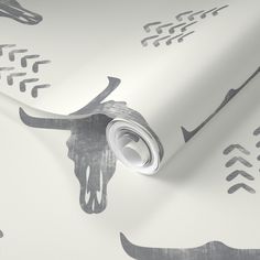 a wallpaper with an animal skull and arrows on it's back drop down