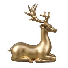 a gold deer statue sitting on top of a white background