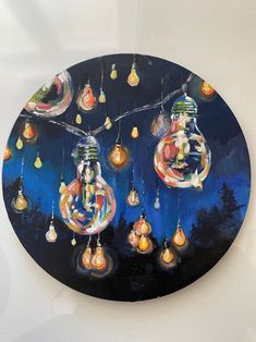 a clock with many lights hanging from it's sides