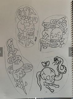 some stickers that are on top of a paper sheet with words and skulls in them