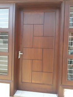 a close up of a wooden door with windows