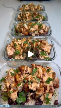 four plastic containers filled with food on top of a table