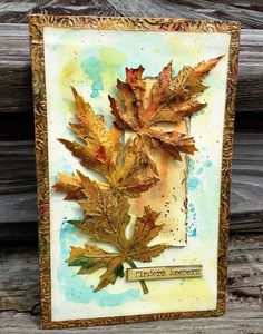 a card with some leaves on it