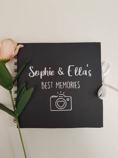 a notepad with the words, best memories written on it next to a flower