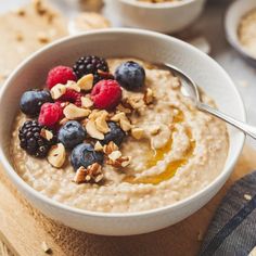 a bowl of oatmeal with fruit and nuts