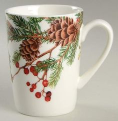 a coffee cup with pine cones and berries on it