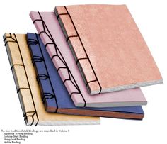 four notebooks stacked on top of each other