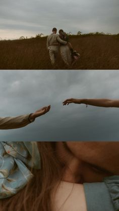 two people standing in a field with their hands extended out to touch each other's foreheads