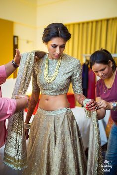 Sangeet Lehengas - Bride Getting Ready in a Dull Gold Lehenga with a Sequinned… Sangeet Lehengas, Cocktail Lehenga, Lehenga Gold, Lehenga For Bride, Grey Lehenga, High Waisted Floral Skirt, Lehenga Bridal, Mumbai Wedding