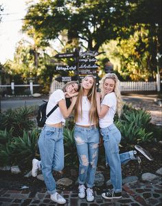 three young women standing next to each other