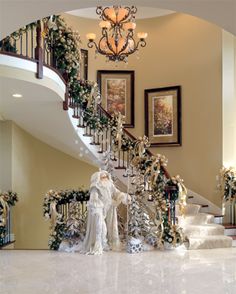 stairs decorated with christmas decorations and greenery are featured in this ad for the home at christmas