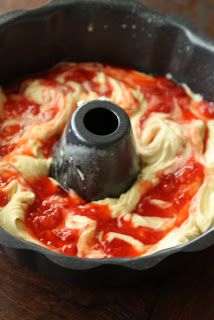 a sauce pan filled with food on top of a wooden table