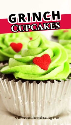 cupcakes with green frosting and red hearts on them