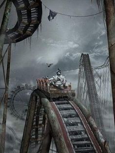 an image of a roller coaster in the middle of a cloudy sky with birds flying over it