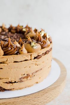 a cake with chocolate frosting and nuts on top