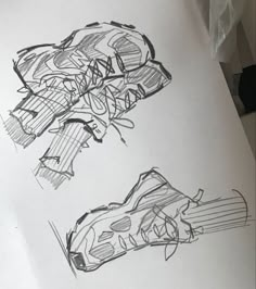 two drawings of shoes on top of a piece of paper